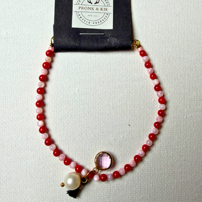 Armband - lig en donkerpienk krale