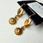 Oorbelle - goudkleur blom en bling